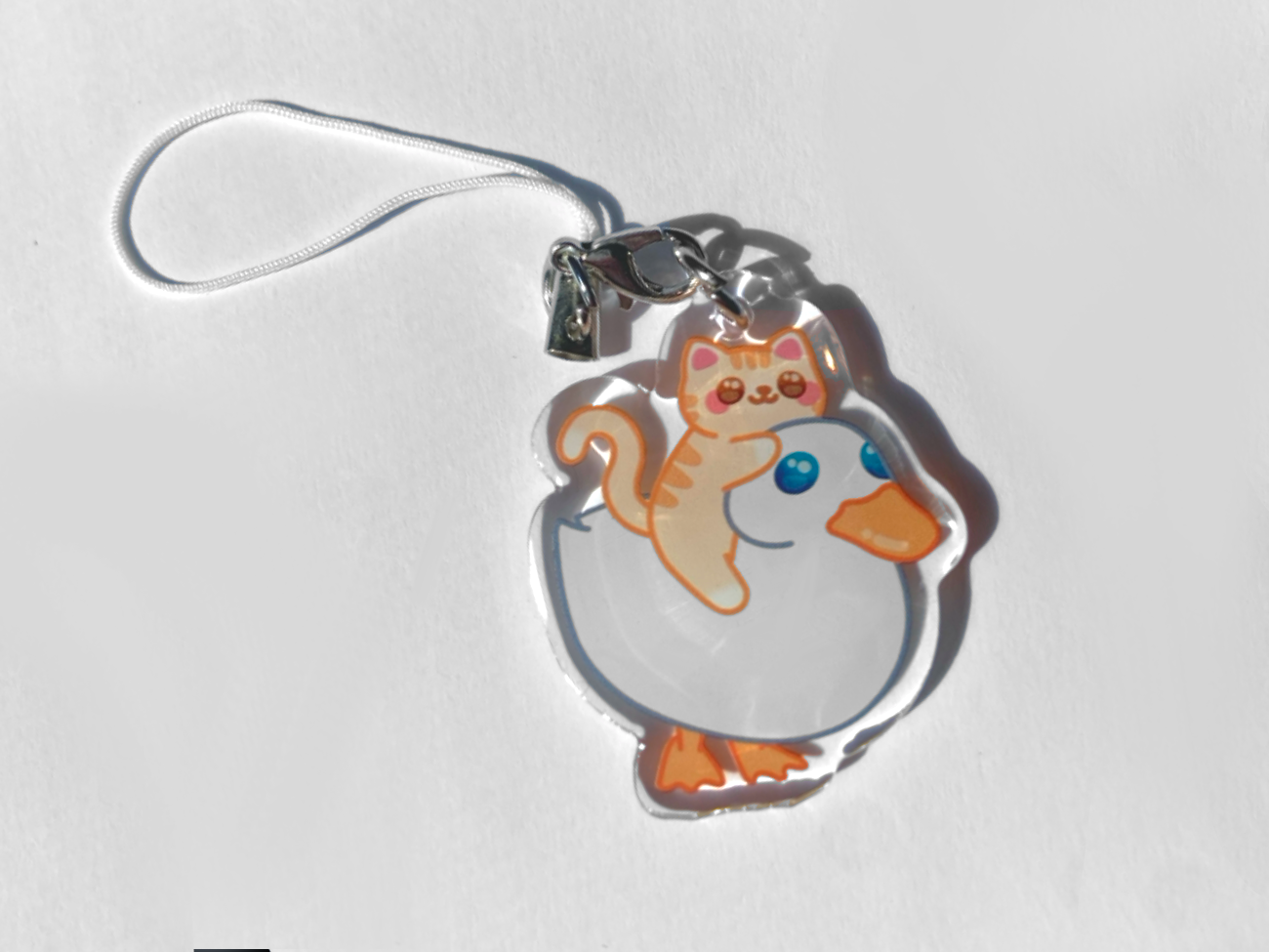 CAT RIDING DUCK PHONE CHARM